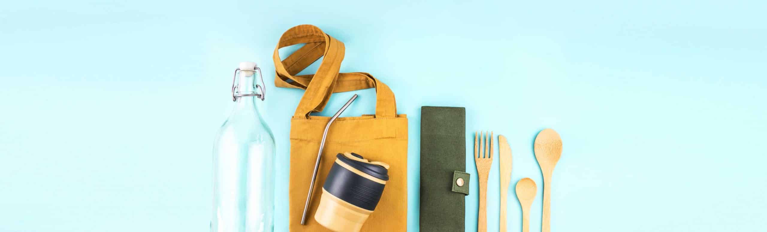 Reusable kitchen items layed against a light blue background