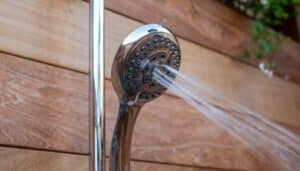 Outdoor shower head spraying water