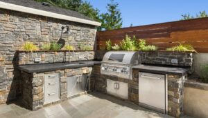 Outdoor kitchen with stone counters and appliances built in