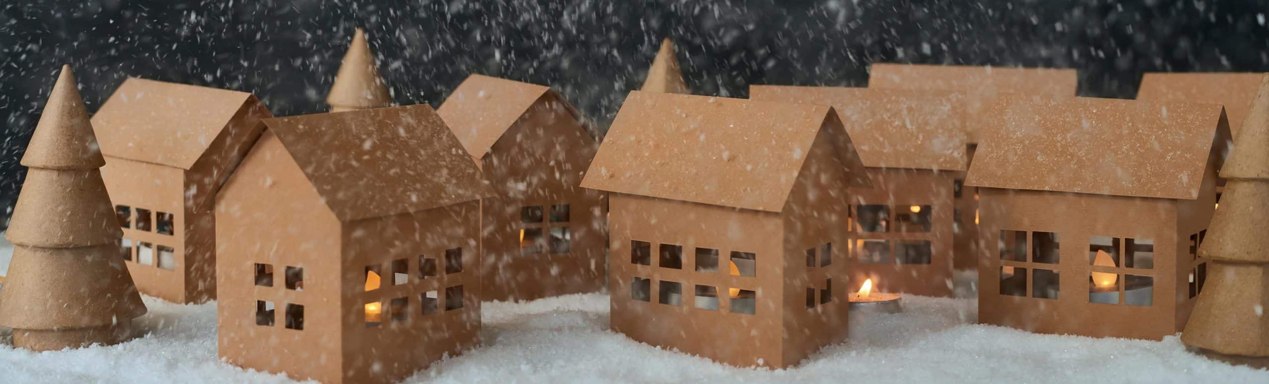 snow falling onto model homes.