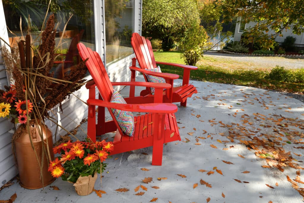 Two Red Chairs on Patio in the Autumn