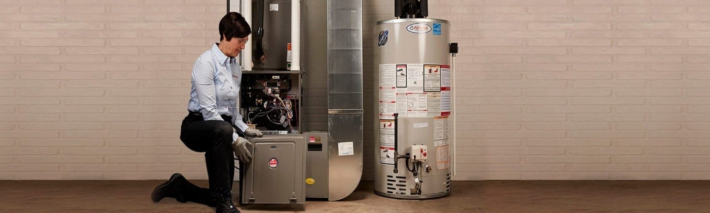 Reliance technician maintaining furnace