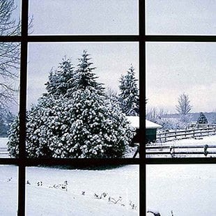 Quiet HVAC operation - Winter scene from inside of home through the window